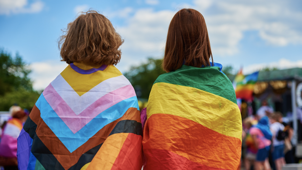 kids draped in transgender and lgbt flags